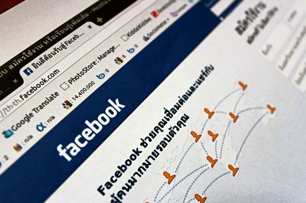 Close-up view of a Facebook webpage displayed on a browser with social media icons. — How to Increase Your TikTok Followers a