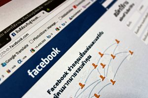 Close-up view of a Facebook webpage displayed on a browser with social media icons. — How to Increase Your TikTok Followers a