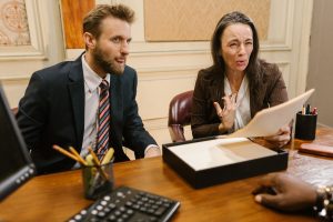 Lawyers discussing legal documents in a professional office setting. — Understanding Patent Law: Essential Insights for Innov